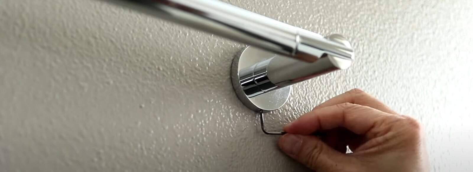 Loosen the Screw of towel bar