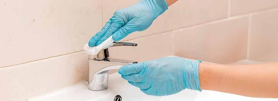 Clean stainless steel faucet with soft cloth
