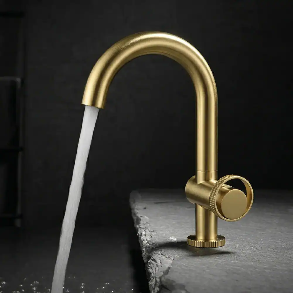 B1004 01 PVD brushed gold basin mixer with side ring handle