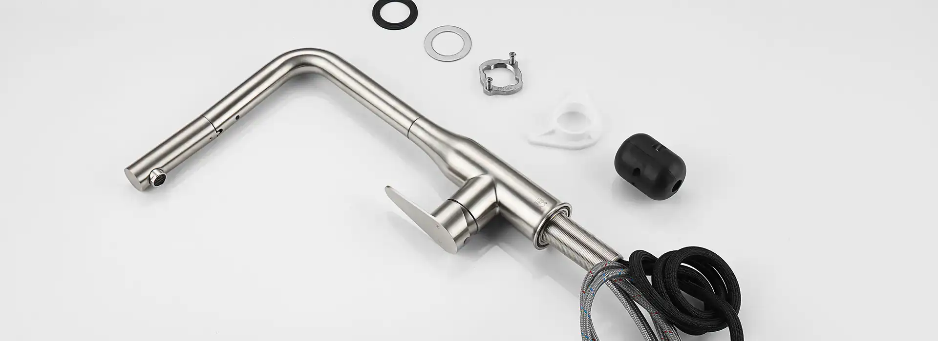 kitchen faucet components on a table